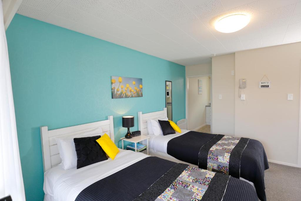 Postel nebo postele na pokoji v ubytování Aden Motel