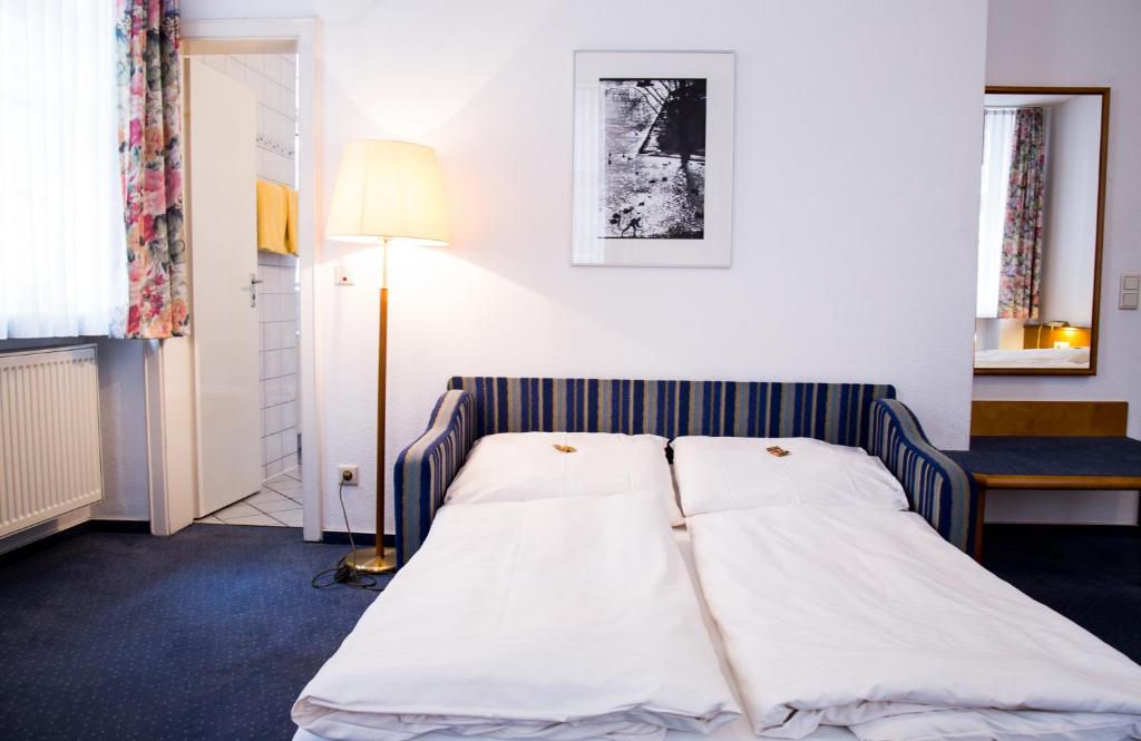 Voodi või voodid majutusasutuse Hotel am Rathaus toas