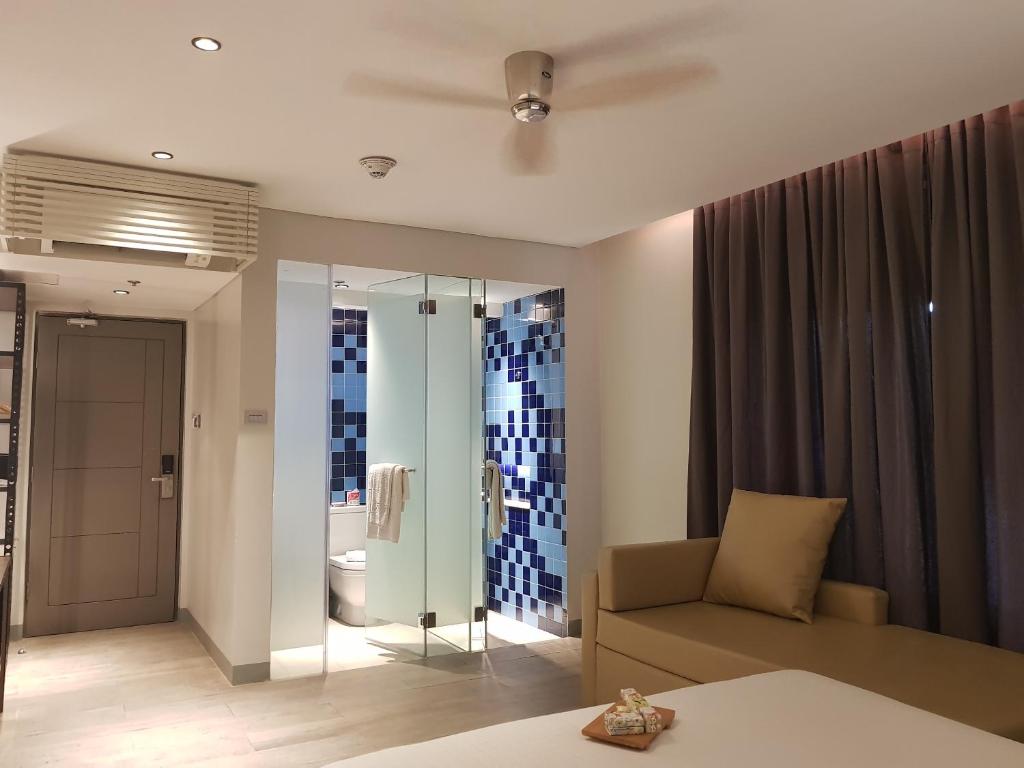 Llit o llits en una habitació de Lagùn Hotel