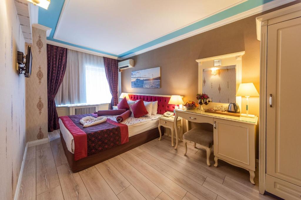 Postel nebo postele na pokoji v ubytování Viva Deluxe Hotel