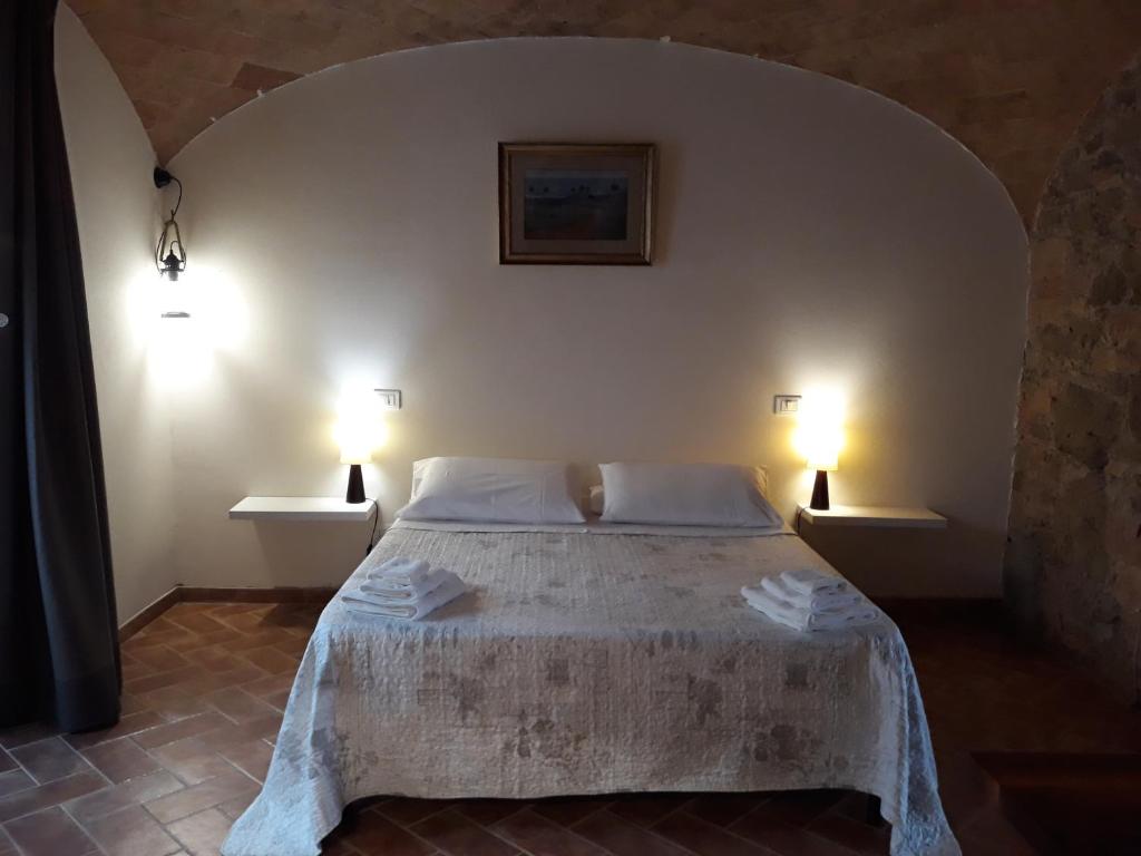 Postel nebo postele na pokoji v ubytování Podere Alberello