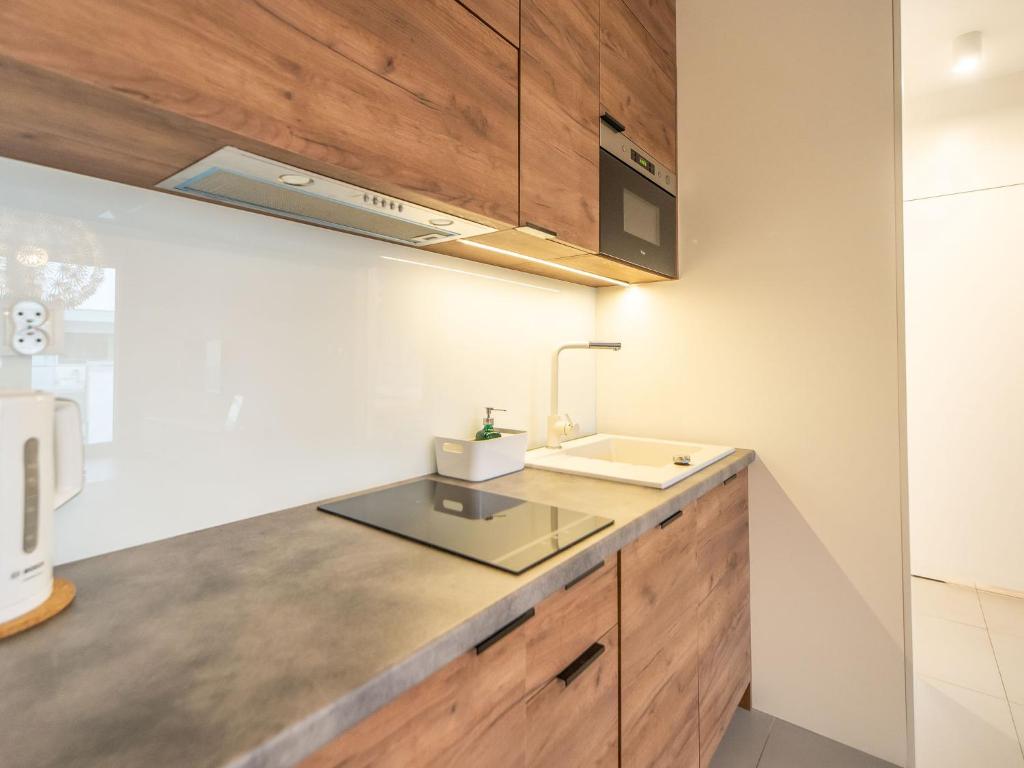 Kuchyňa alebo kuchynka v ubytovaní Apartamenty Bliżej morza - visitopl