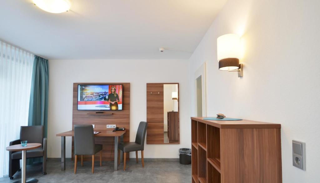 TV a/nebo společenská místnost v ubytování Neu Heidelberg - Guesthouse & Apartments