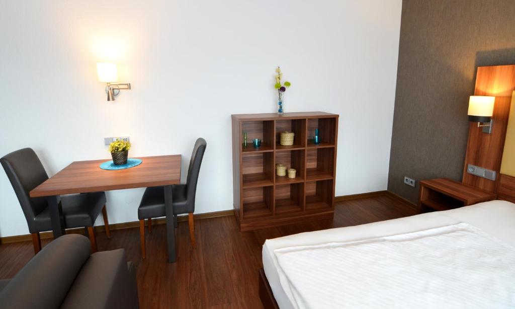 Postel nebo postele na pokoji v ubytování Neu Heidelberg - Guesthouse & Apartments