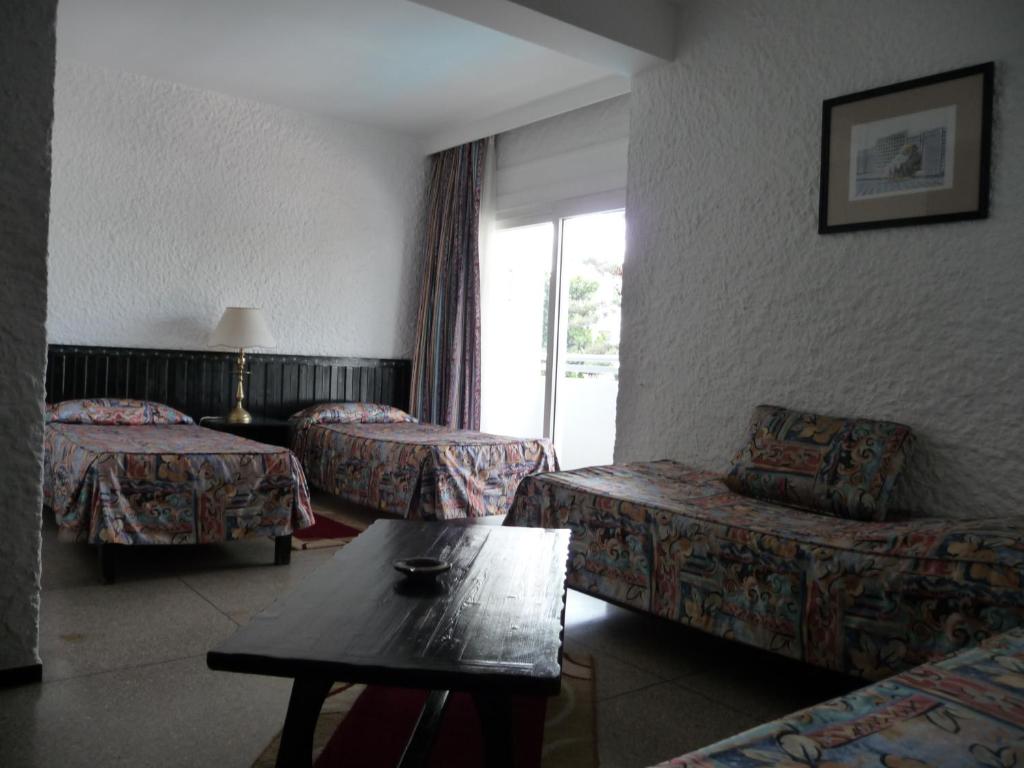 Postel nebo postele na pokoji v ubytování HOTEL KAMAL CITY CENTER
