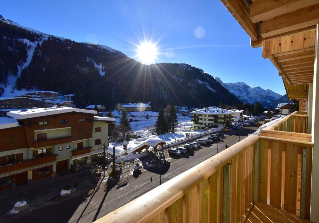 a view of a parking lot with a snow covered mountain at EMERALD CENTRALE in Madonna di Campiglio