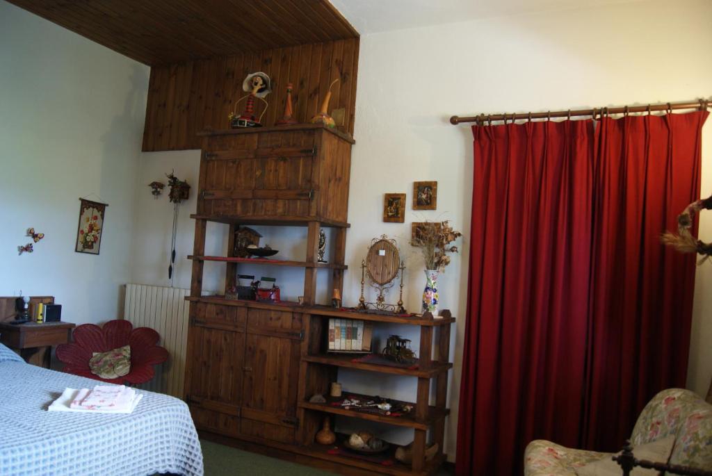 Postel nebo postele na pokoji v ubytování B&B IL QUERCETO