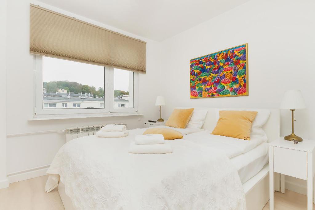Postel nebo postele na pokoji v ubytování Apartamenty Laguna Gdynia by Renters