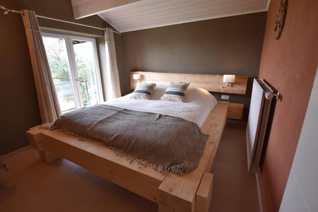 Postel nebo postele na pokoji v ubytování Le Sorbier - Gîte et chambres d'hôtes