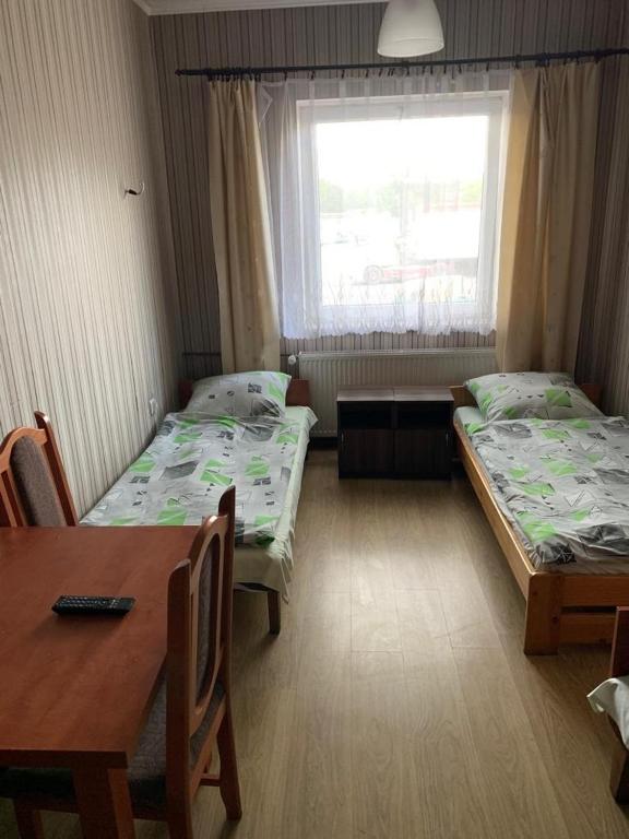 Posteľ alebo postele v izbe v ubytovaní mPark Noclegi Śląsk Mysłowice
