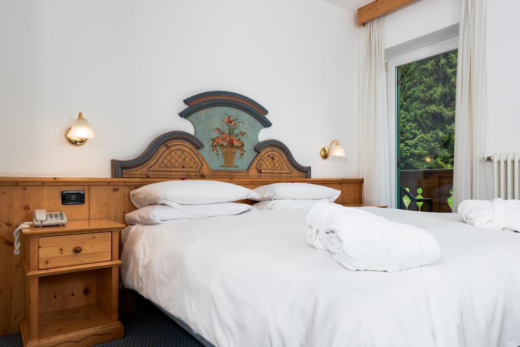 Postel nebo postele na pokoji v ubytování Hotel Valacia