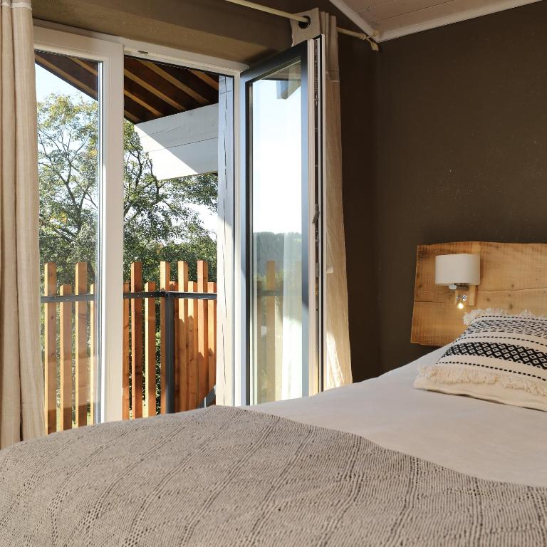 Postel nebo postele na pokoji v ubytování Le Sorbier - Gîte et chambres d'hôtes