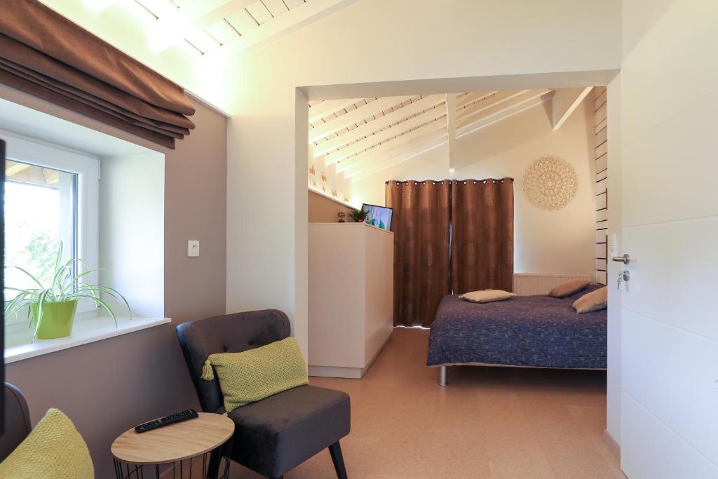 Postel nebo postele na pokoji v ubytování Le Sorbier - Gîte et chambres d'hôtes