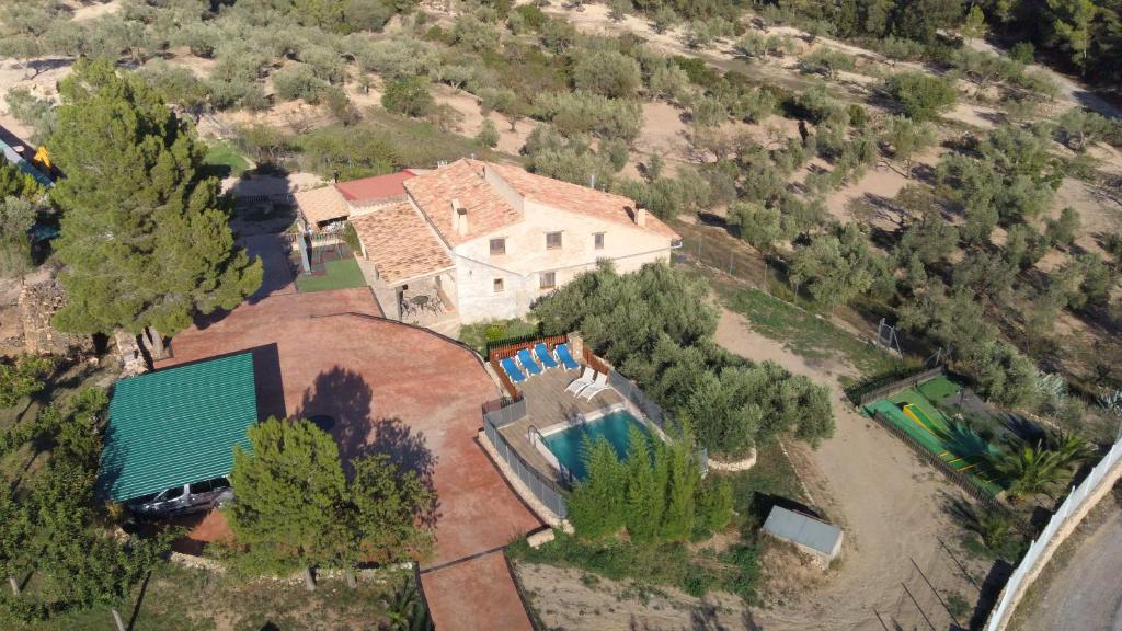 an aerial view of a house with a swimming pool at Mas Augueró in Paúls