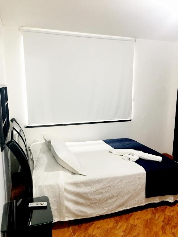 Postel nebo postele na pokoji v ubytování Hotel Casa Paulina