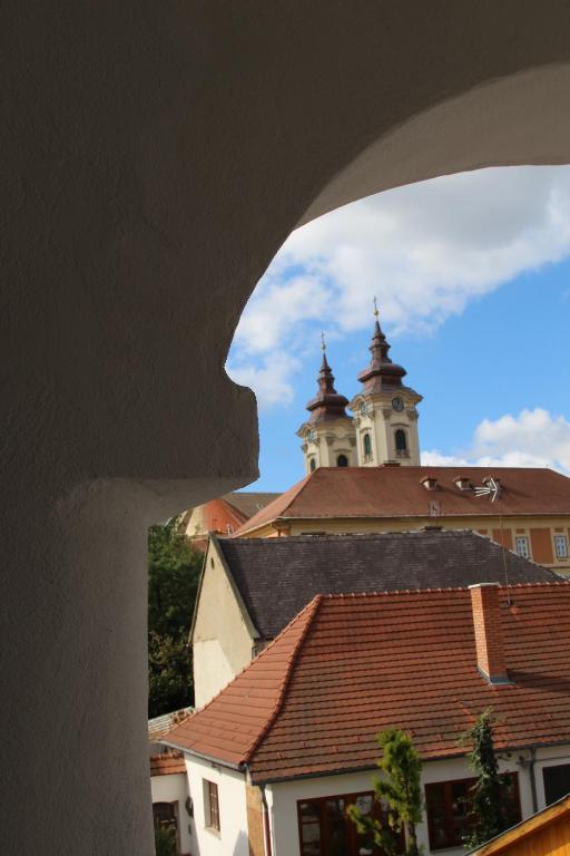 a view of a building with a clock tower at Demetrovics Udvarház in Eger
