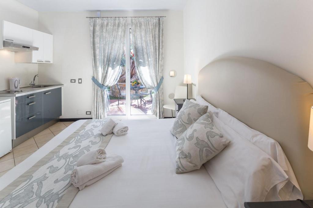 Łóżko lub łóżka w pokoju w obiekcie Villa Giada Resort