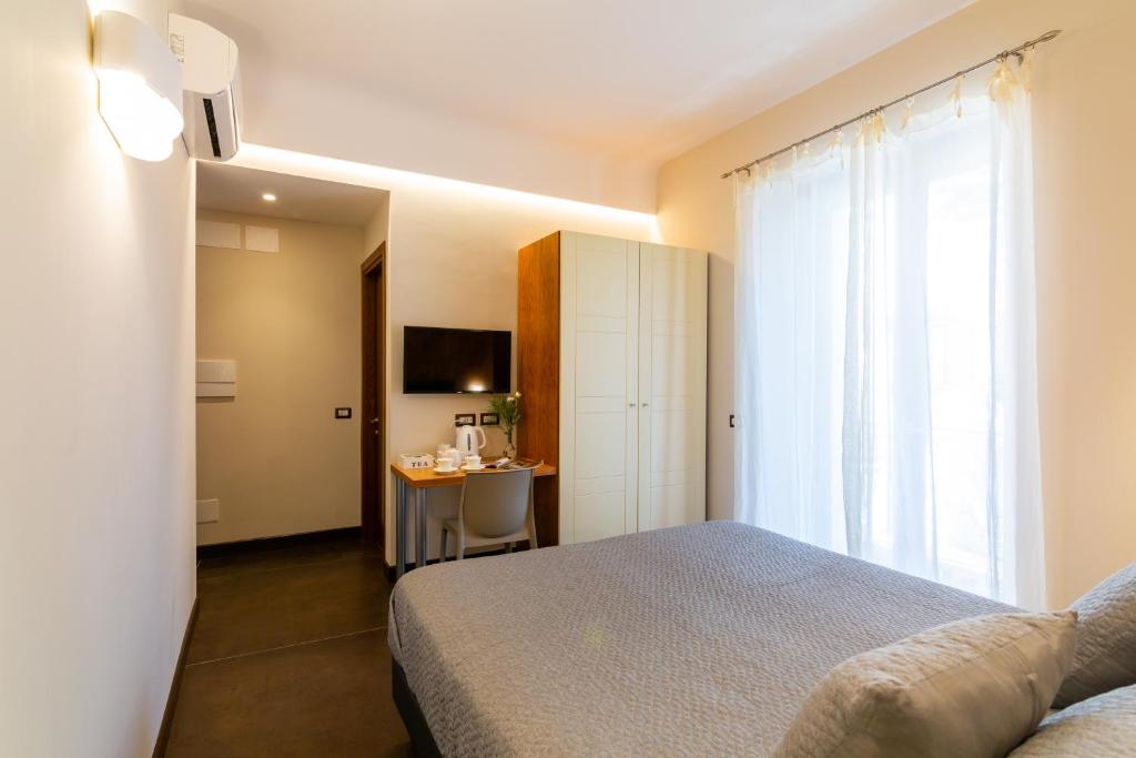 Postel nebo postele na pokoji v ubytování Il Melograno Relais