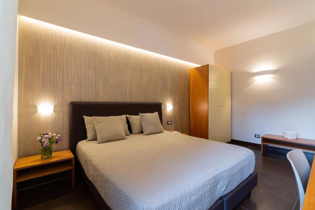 Postel nebo postele na pokoji v ubytování Il Melograno Relais