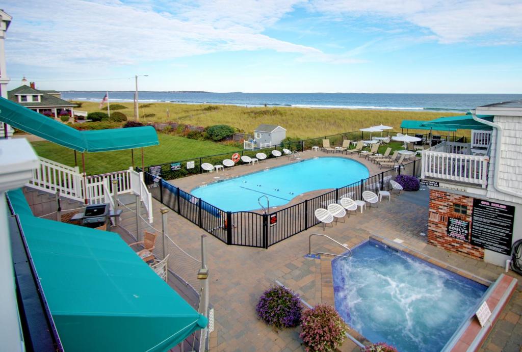 an overhead view of a swimming pool and the ocean at Sea Cliff House Motel in Old Orchard Beach