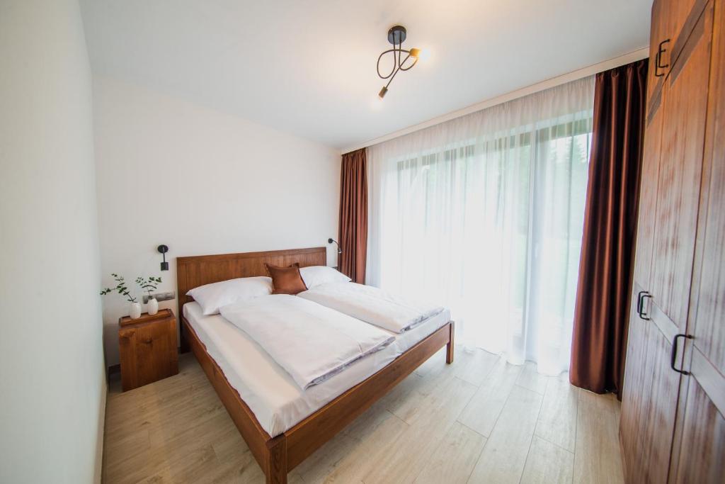 Postel nebo postele na pokoji v ubytování Apartmány Bílá 188