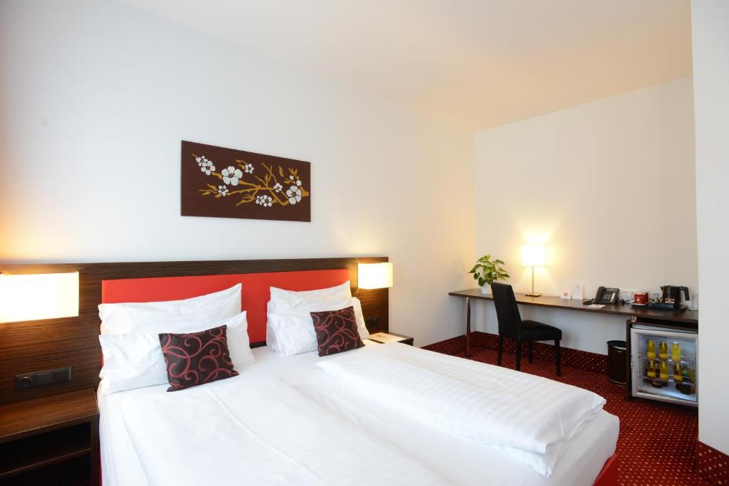 Postel nebo postele na pokoji v ubytování Best Western Plus Amedia Wien