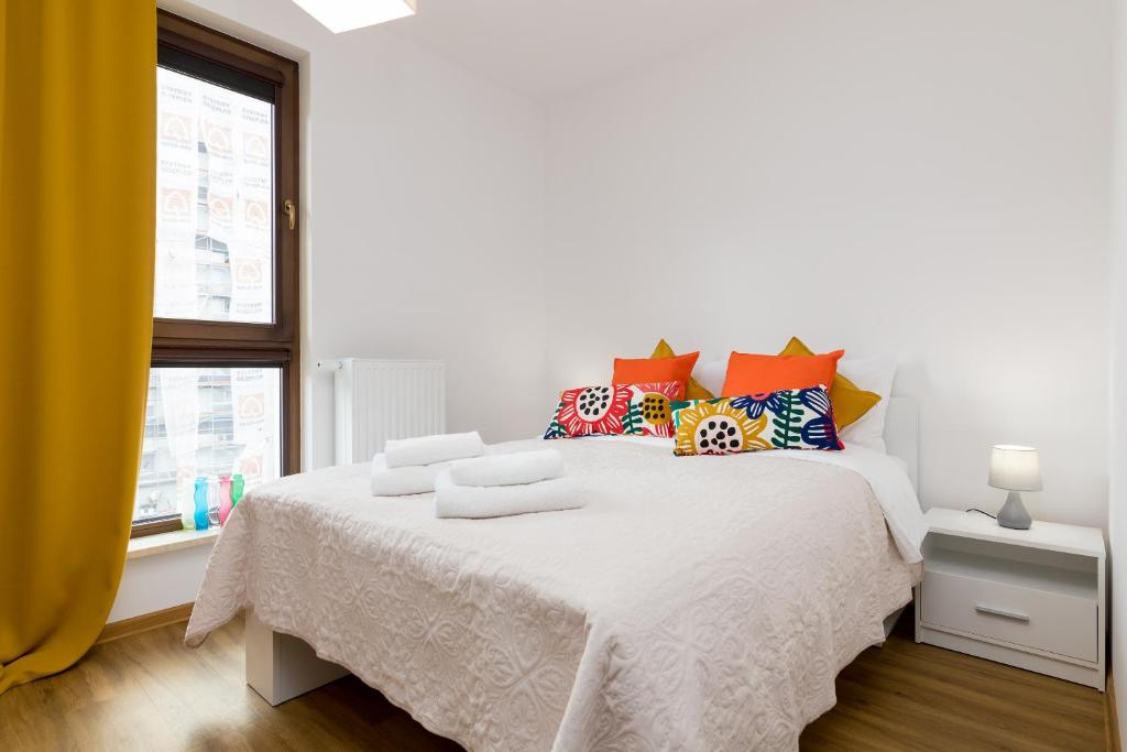 מיטה או מיטות בחדר ב-Wola Business Apartments