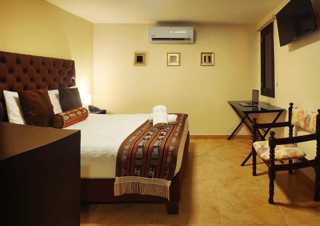 Postel nebo postele na pokoji v ubytování Hotel Alamos Del Parque