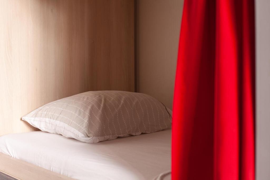 Postel nebo postele na pokoji v ubytování Urban Hostel & Apartments