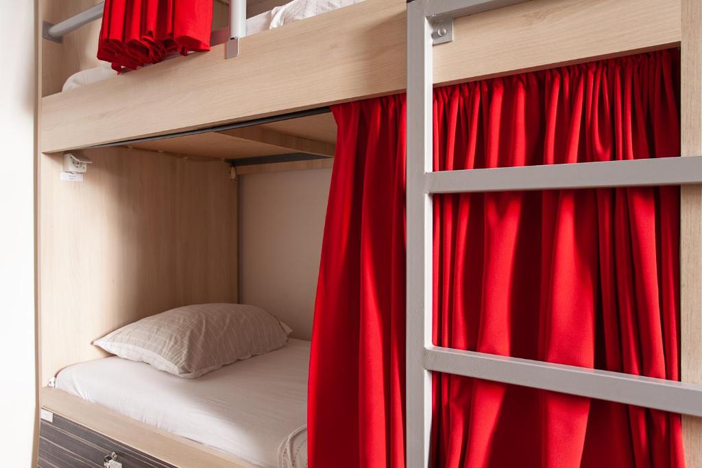 Postel nebo postele na pokoji v ubytování Urban Hostel & Apartments