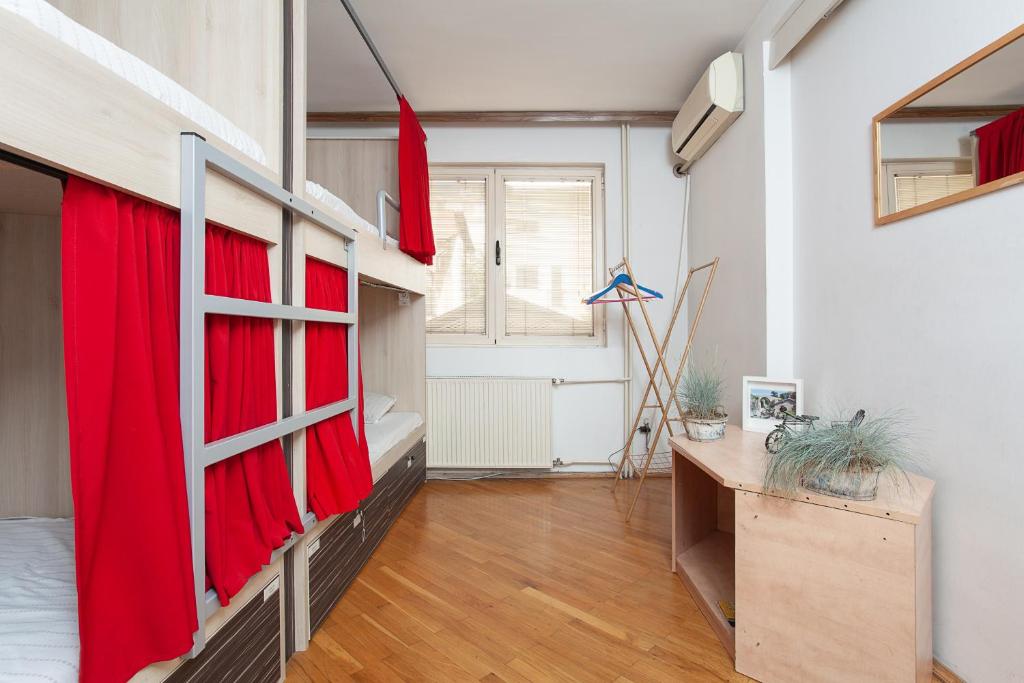Postel nebo postele na pokoji v ubytování Urban Hostel & Apartments