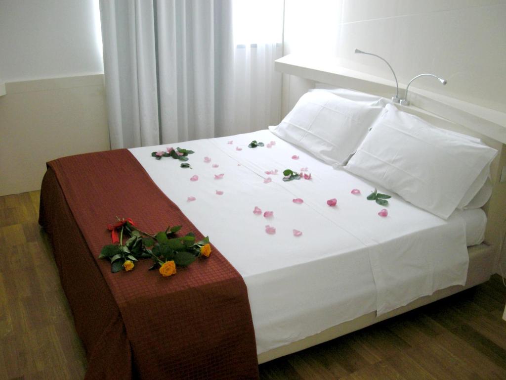 Postel nebo postele na pokoji v ubytování Hotel Excelsior