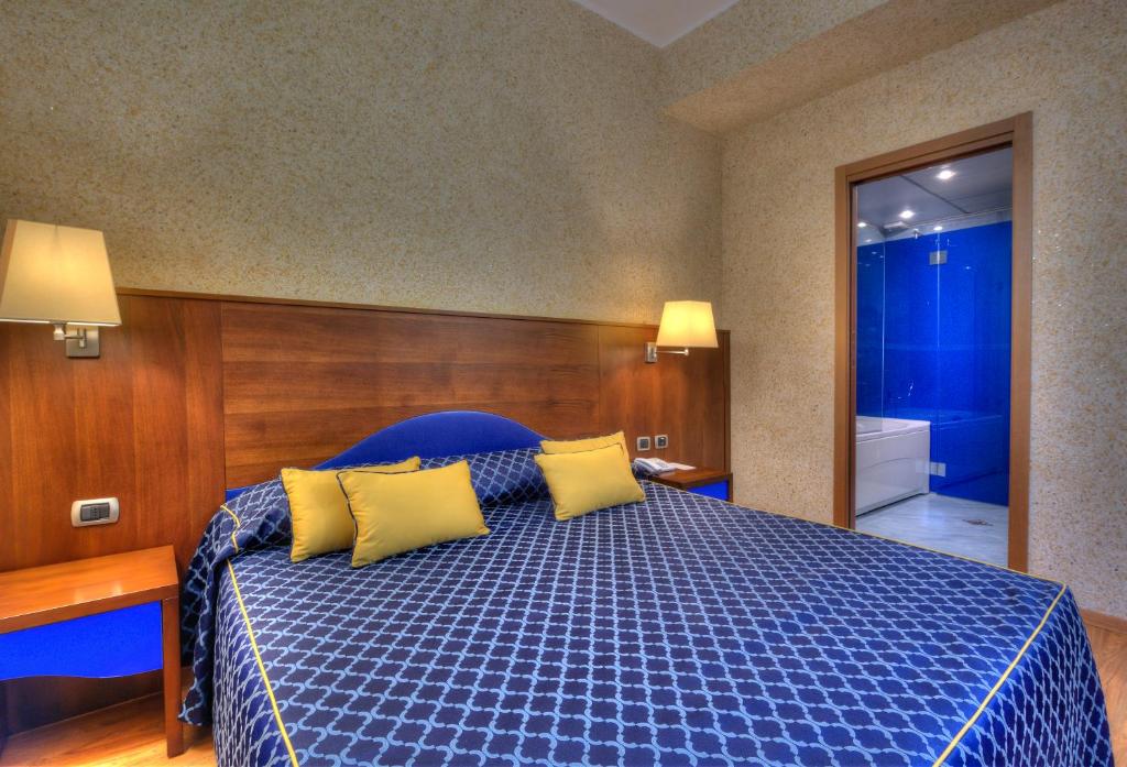 Postel nebo postele na pokoji v ubytování Central Park Hotel Modena