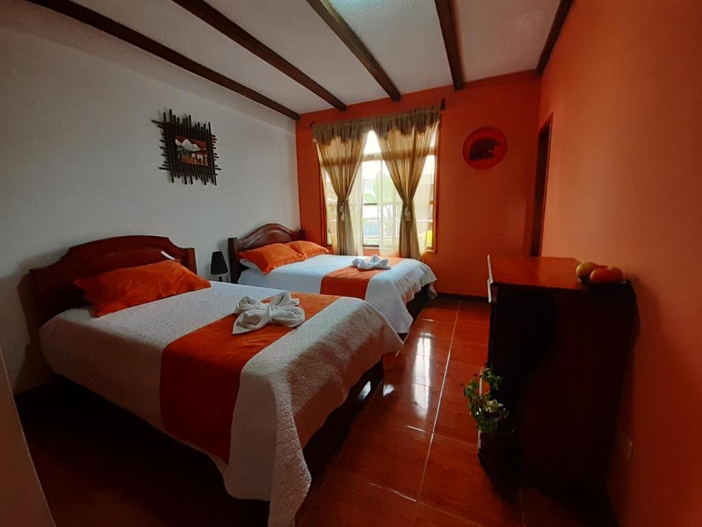 Postel nebo postele na pokoji v ubytování Suymar Ecolodge Galapagos
