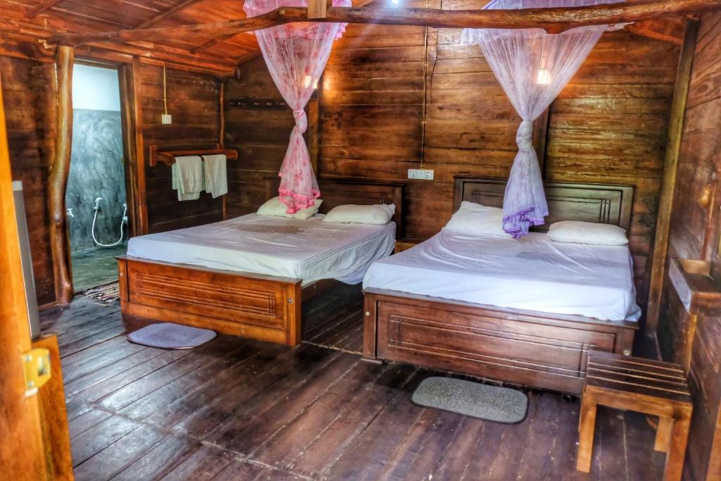 Postel nebo postele na pokoji v ubytování Golden Rainbow Guest House