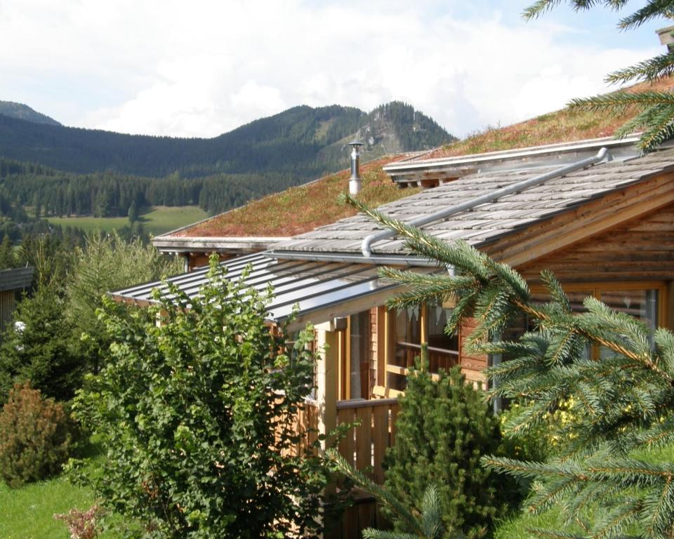 a house with solar panels on the roof at Tauern-Hütt'n - Schanzer Hütt'n in Hohentauern
