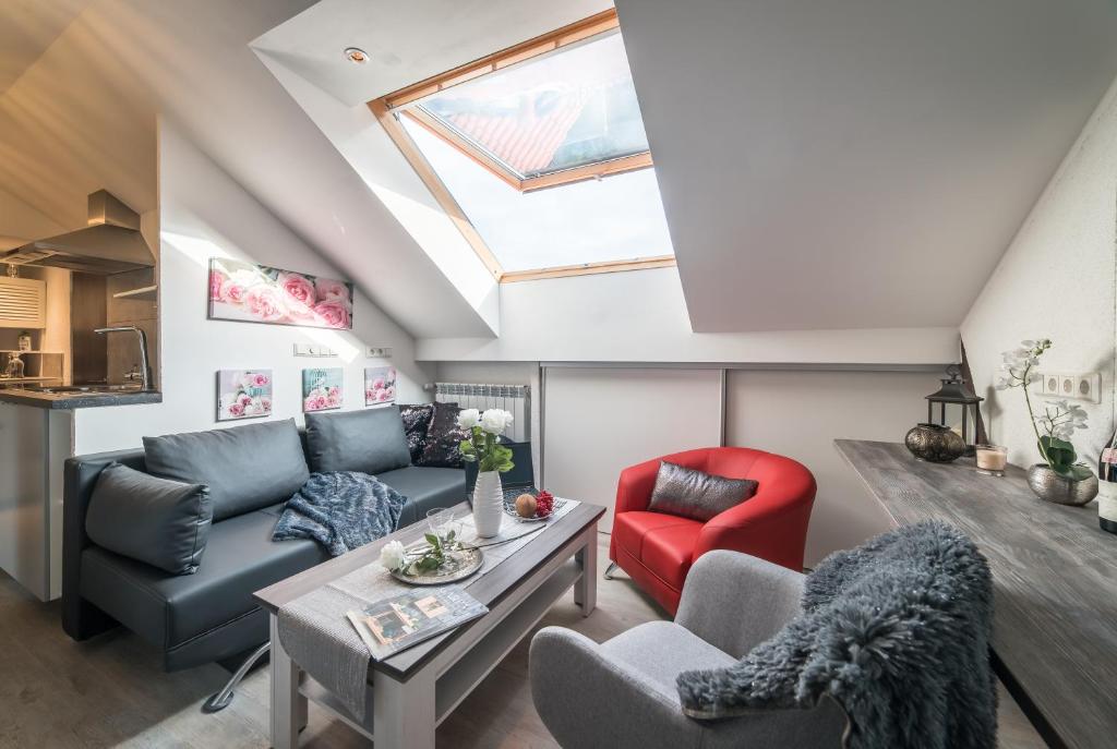 a loft conversion living room with a skylight at mountain-view-apartments de in Thale
