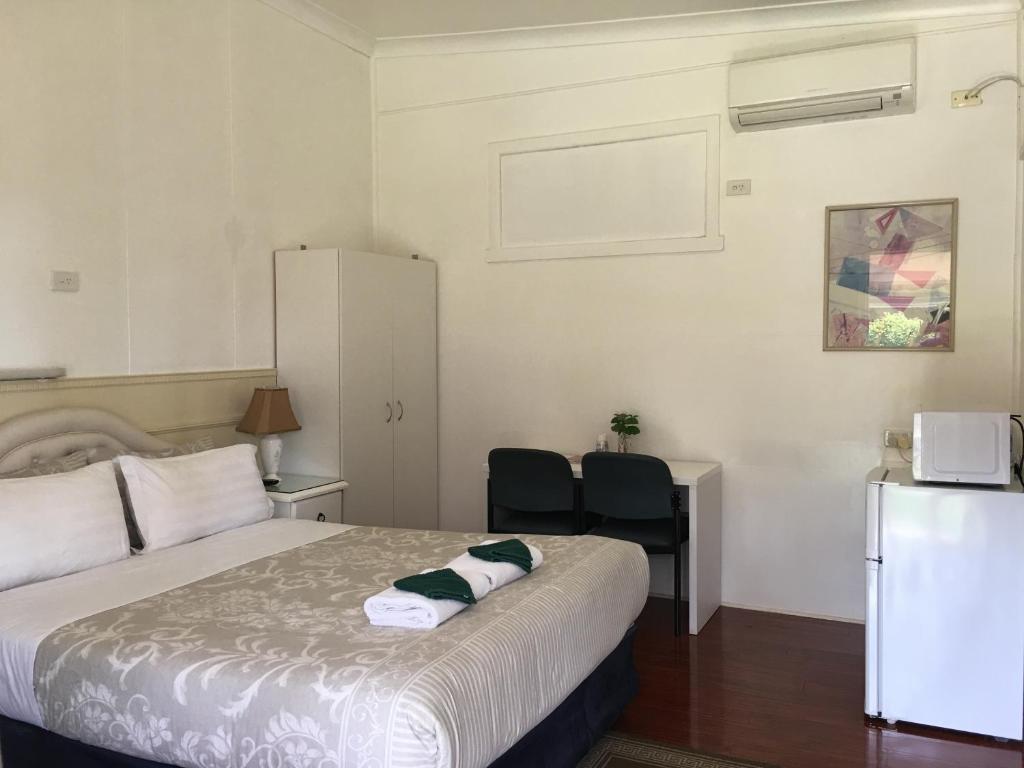 Postel nebo postele na pokoji v ubytování Major Innes Motel