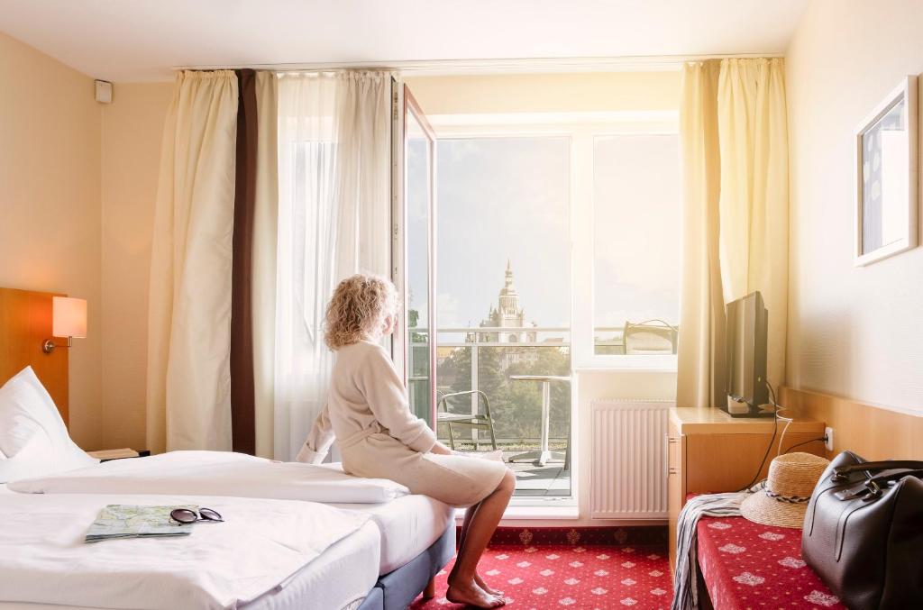 TV a/nebo společenská místnost v ubytování Hotel am Jungfernstieg