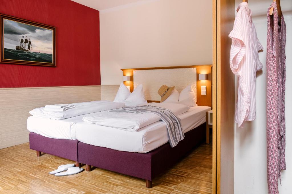 Postel nebo postele na pokoji v ubytování Hotel am Jungfernstieg