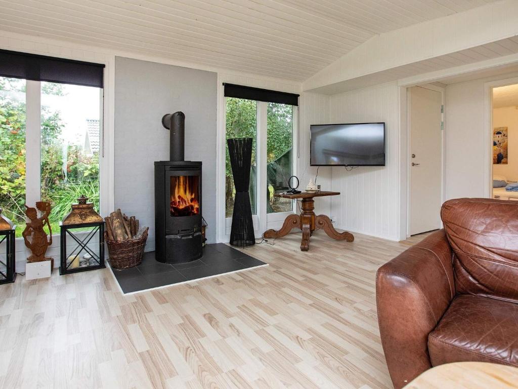 TV a/nebo společenská místnost v ubytování Holiday home Dannemare XII