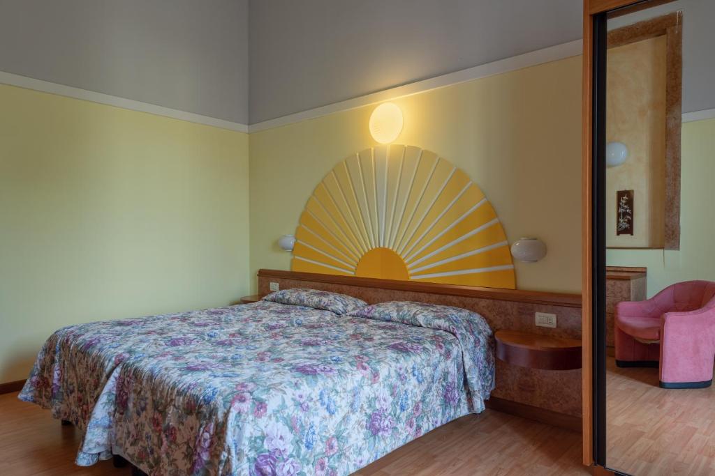Postel nebo postele na pokoji v ubytování Park Hotel Jolanda