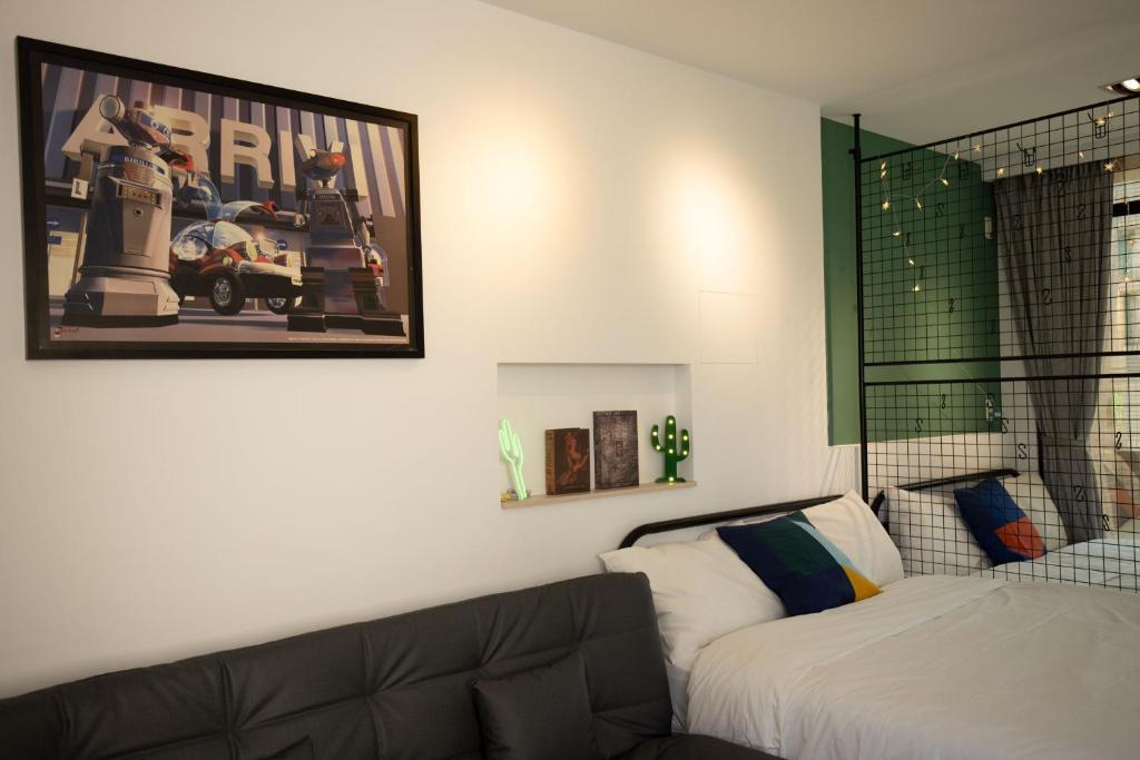 Postel nebo postele na pokoji v ubytování YouI98 Guesthouse一層一戶大坪數套房#本國旅客須先匯款