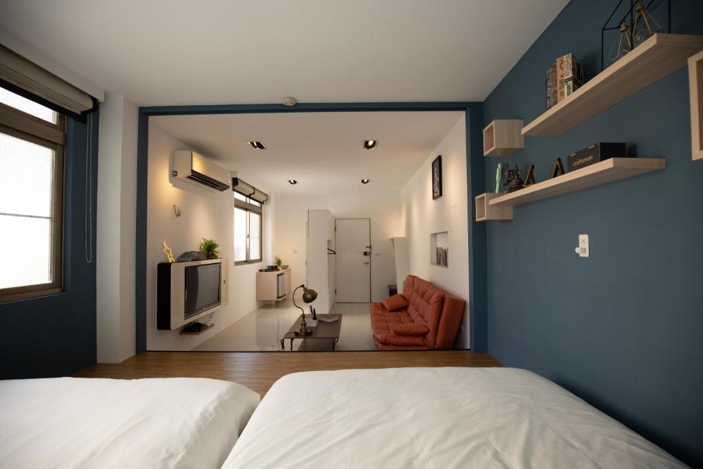Postel nebo postele na pokoji v ubytování YouI98 Guesthouse一層一戶大坪數套房#本國旅客須先匯款