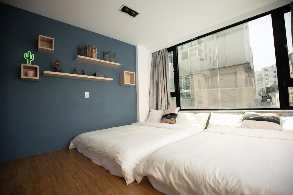 Postel nebo postele na pokoji v ubytování YouI98 Guesthouse一層一戶大坪數套房#本國旅客須先匯款