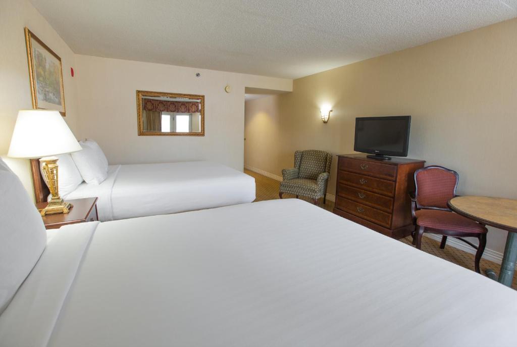 Кровать или кровати в номере Music Road Resort Hotel and Inn