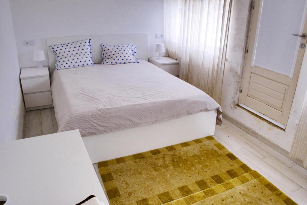 Postel nebo postele na pokoji v ubytování casa das pombas