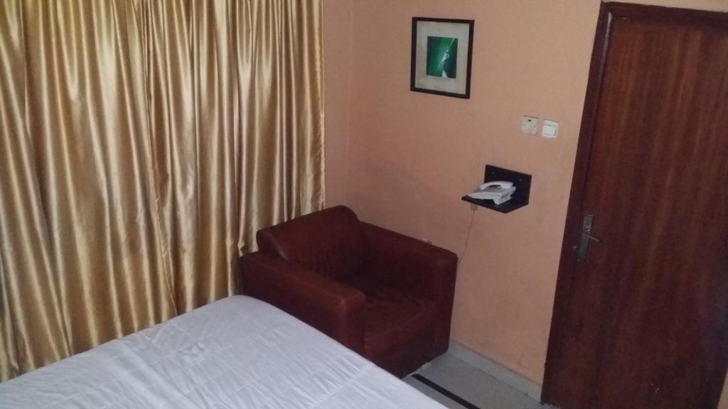 Postel nebo postele na pokoji v ubytování JCB Hotel