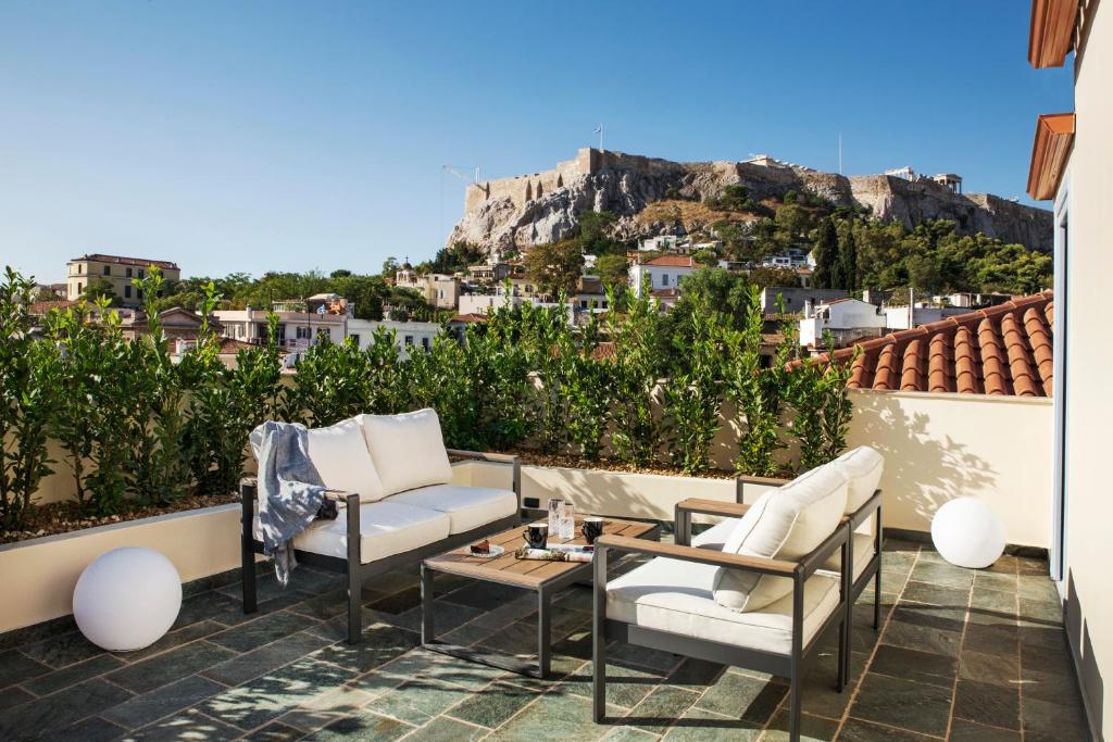 a living room with a bench and a patio at A77 Suites by Andronis in Athens