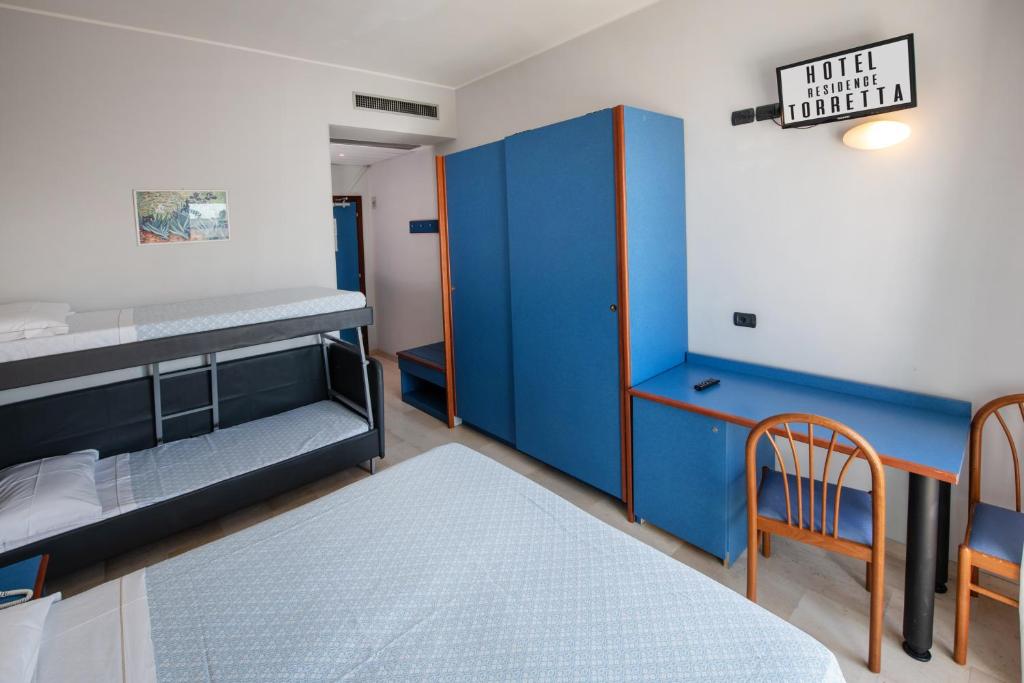 Łóżko lub łóżka w pokoju w obiekcie Hotel Torretta